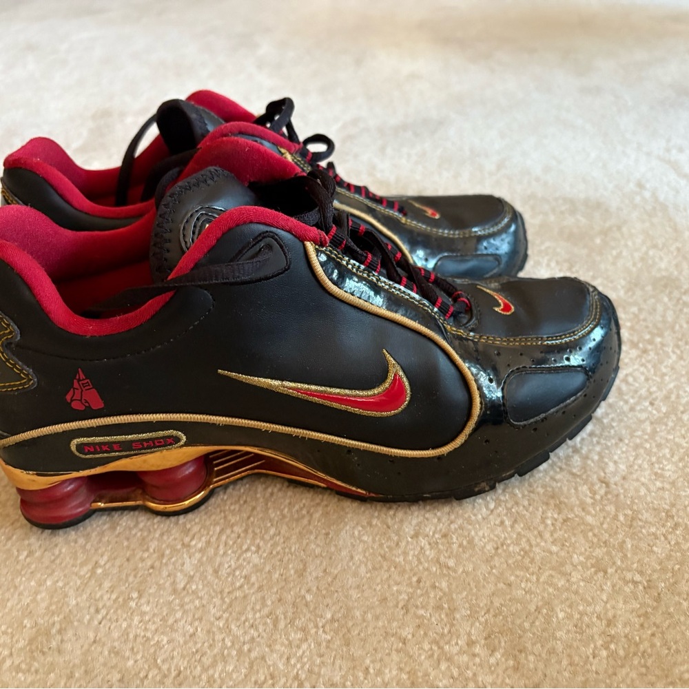 Nike men’s Gold Sneakers with Red Accents 25th anniversary shoe